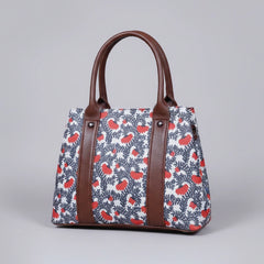 Premium floral print ethnic handbag made of cotton fabric with dual zips.