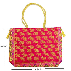 An ethnic silk shoulder bag for market use, with fine zari work and sturdy handle.