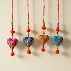 Handcrafted Cotton Printed Fabric Heart Hanging in Four Colours — Pink, Blue, Orange and Sky Blue — with Mandala Lace Patch, Red Cord and Orange Pom Poms