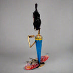 Intricately painted figurine candle stand adding sophistication and charm to living spaces.
