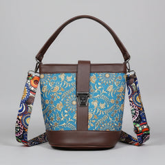 Front view of a 9x9 inch square sling bag featuring a vibrant floral print fabric and brown PU leather accents.