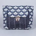 Front view of the 10x8 inch floral Jacquard sling bag with golden button closure