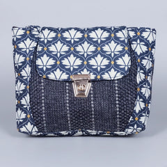 Front view of the 10x8 inch floral Jacquard sling bag with golden button closure