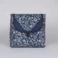 Front view of a 10x10 inch black sling bag with floral motifs and a front flap button closure