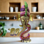 A decorative Ganesh idol with a tea light candle holder built into the back.

