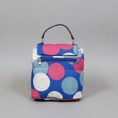 Geometric printed sling bag featuring both a side sling strap and a top handle