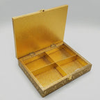 Open gold-tone foil wooden dry fruit box showing four compartments, a textured interior and hinged lid