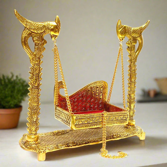 Golden Krishna Jhula swing with parrot design and velvet seat for Janmashtami.