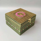 Golden oxidized wooden dry fruit box with floral and peacock motifs