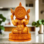 Hand-carved lotus Ganesha figurine featuring crown, laddu, mouse and intricate jewelry details.