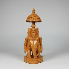 Artisanal wood carving of a traditional Mahavat riding a royal Ambabari elephant with deep-relief textures.