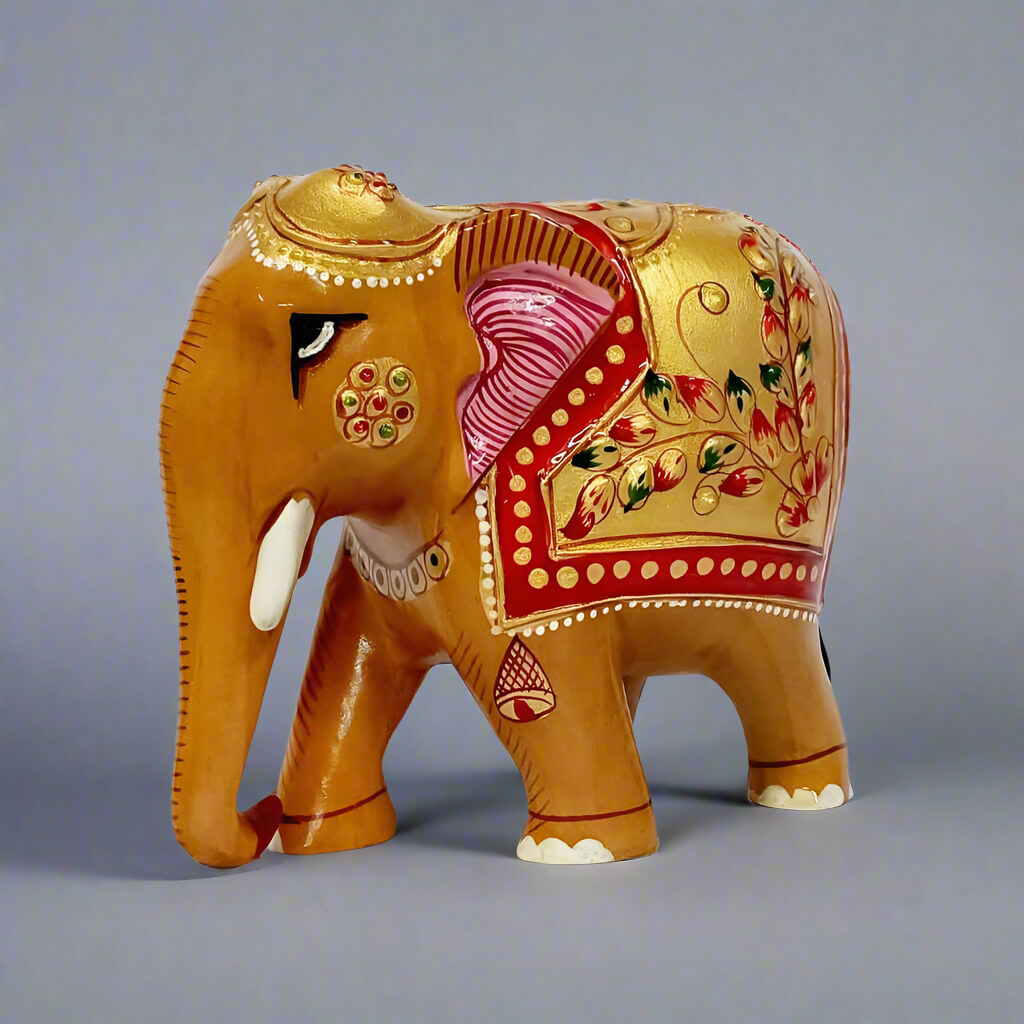 Hand-carved wooden elephant figurine featuring intricate embossed floral designs
