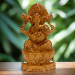 A hand-carved wooden Ganesh figurine that brings happiness, prosperity, and wisdom.
