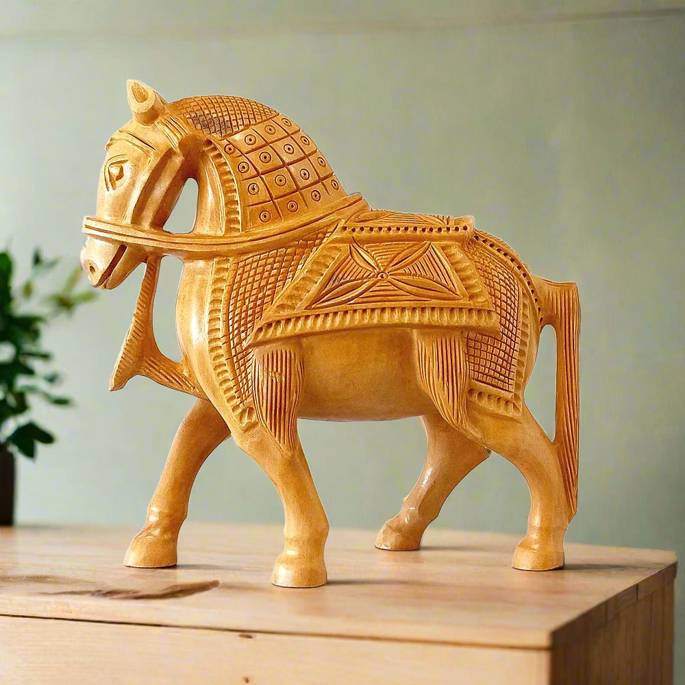 A beautiful hand-carved wooden statue of a walking horse.