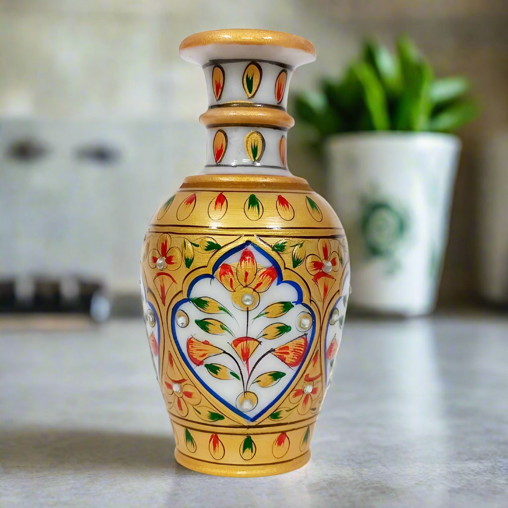 A hand-painted marble flower pot with a unique, multi-colored design.