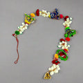 A hand-painted papermache toran, a traditional and vibrant door hanging.