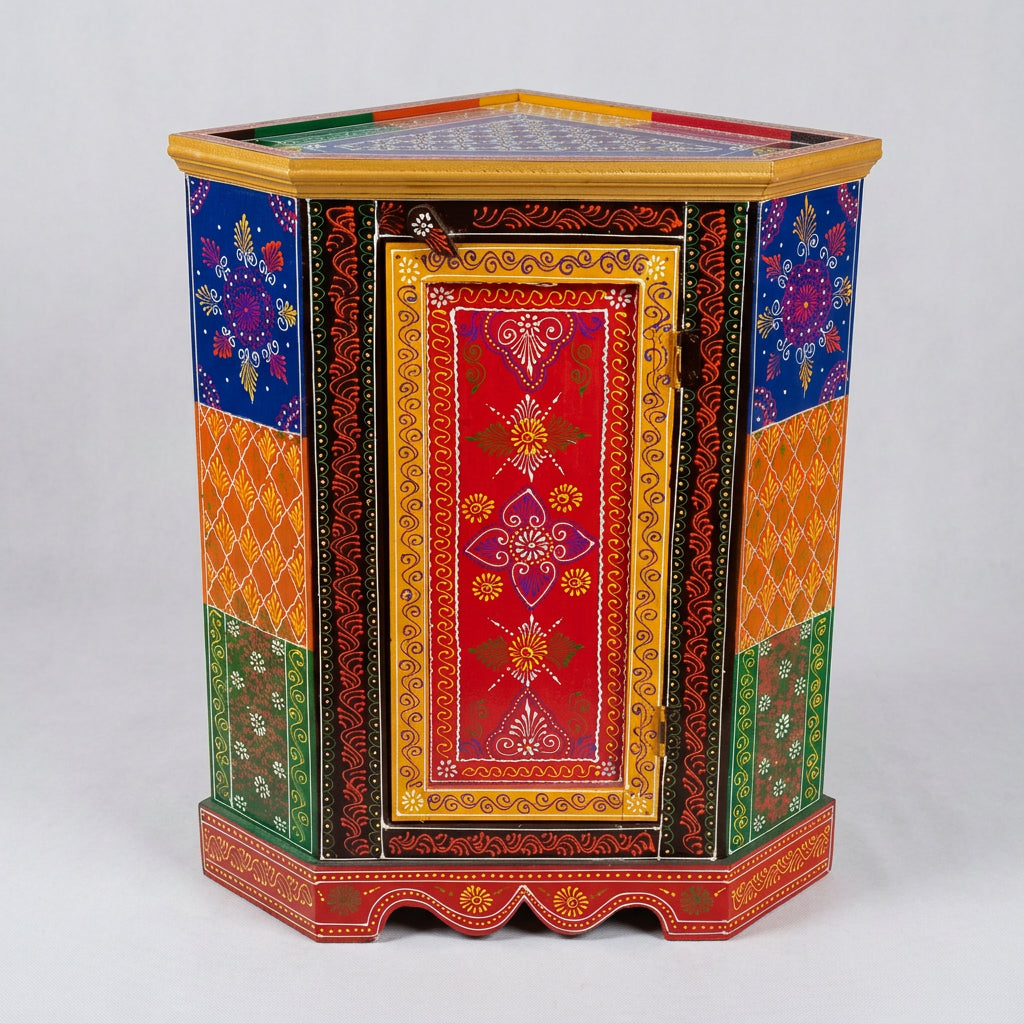 Front view of hand-painted wooden corner cabinet with a red floral door, multicolour side panels and gold-tone borders