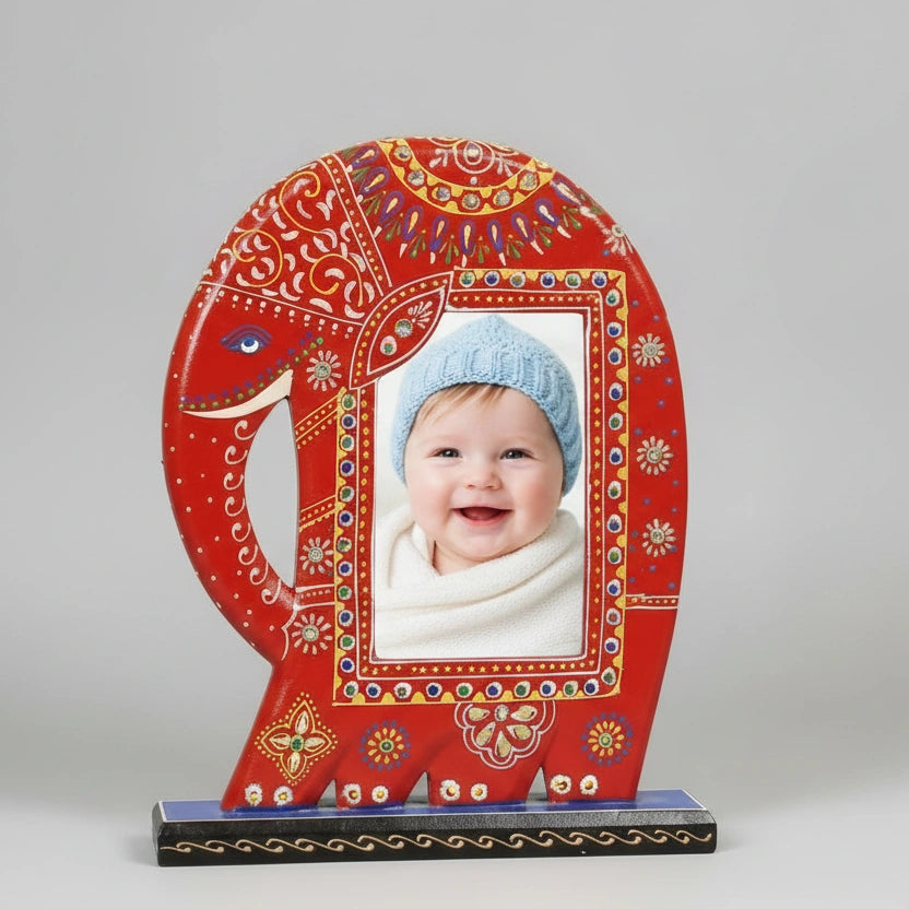 Large 11x9 inch hand-painted red wooden elephant photo frame with detailed white and gold emboss painting, holding a 6x4 landscape photograph.