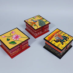 A 10cm square wooden painted jewellery box featuring unique hand-painted floral motifs on a natural wood finish.