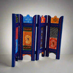 Ethnic-style wooden decor panel featuring intricate floral artwork in bold, vibrant colors.