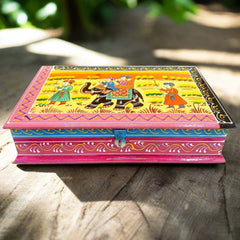 A hand-painted wooden trinket box with a traditional Indian miniature art design.