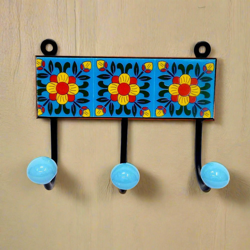  A handcrafted Blue Pottery 3-hook wall hanger, a beautiful addition to an entryway or hallway.