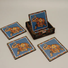 Top-down view of six colorful handcrafted wooden coasters arranged in a circle to show unique designer patterns.