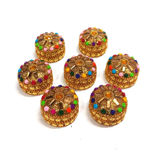 A handmade kumkum box with intricate details and a secure lid.