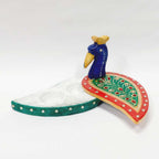 Handcrafted marble Chopra Kumkum holder with intricate artwork.