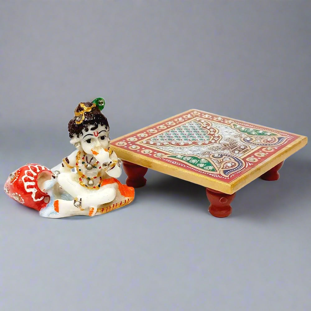 Handcrafted marble Chowki Krishna idol with fine traditional artwork.