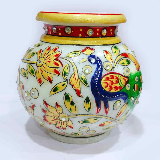 A handmade marble pooja pot and kalash set with intricate carvings.