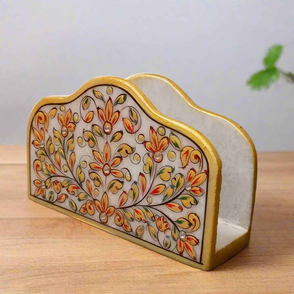 Handcrafted marble tissue holder with floral artwork and gold border