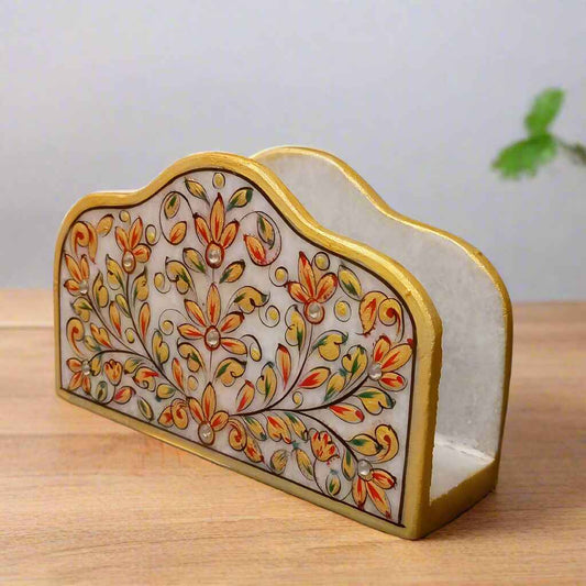 Handcrafted marble tissue holder with floral artwork and gold border