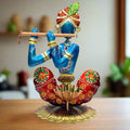 A handcrafted, multicolor Krishna tealight holder, perfect for home decor.
