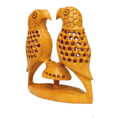 Handcrafted wooden parrot statue with fine undercut craftsmanship.