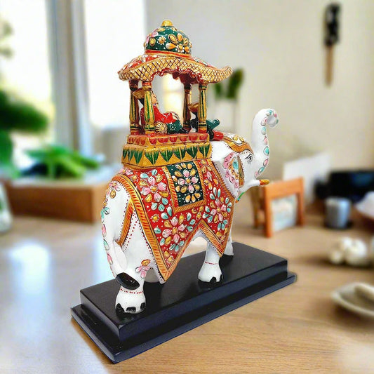 A handcrafted Rajasthani elephant souvenir, decorated in the traditional Ambari style.