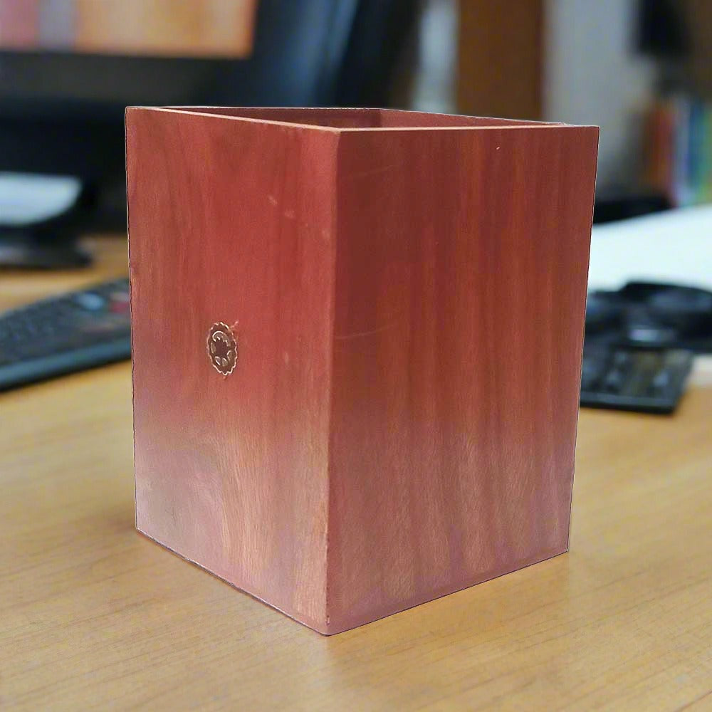 Handcrafted Sheesham wood pen holder with traditional gemstone artwork.
