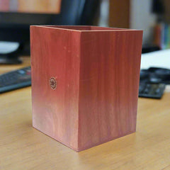 Handcrafted Sheesham wood pen holder with traditional gemstone artwork.
