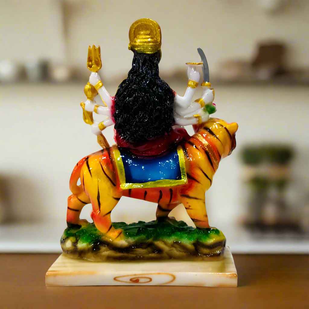 Beautifully crafted and hand-painted Durga murti with expressive features and ornate traditional attire.