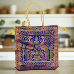 A handcrafted silk bag with a strong golden handle, the best gift item for any occasion.