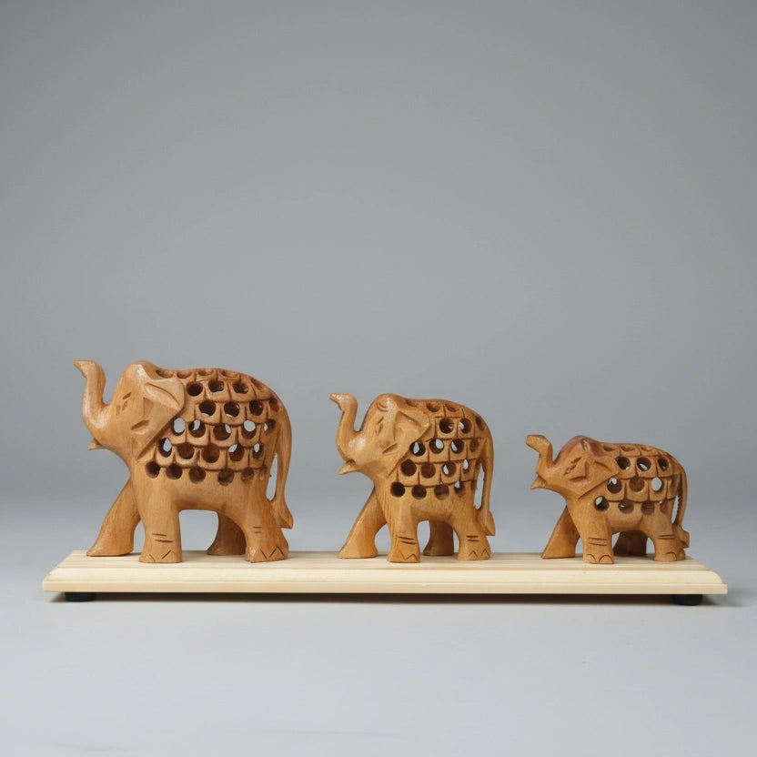 Close-up of traditional undercut carving on a Kadamb wood elephant bridge, showcasing the hollow lattice design and natural wood grain.