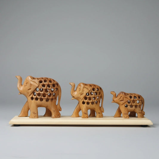 Close-up of traditional undercut carving on a Kadamb wood elephant bridge, showcasing the hollow lattice design and natural wood grain.