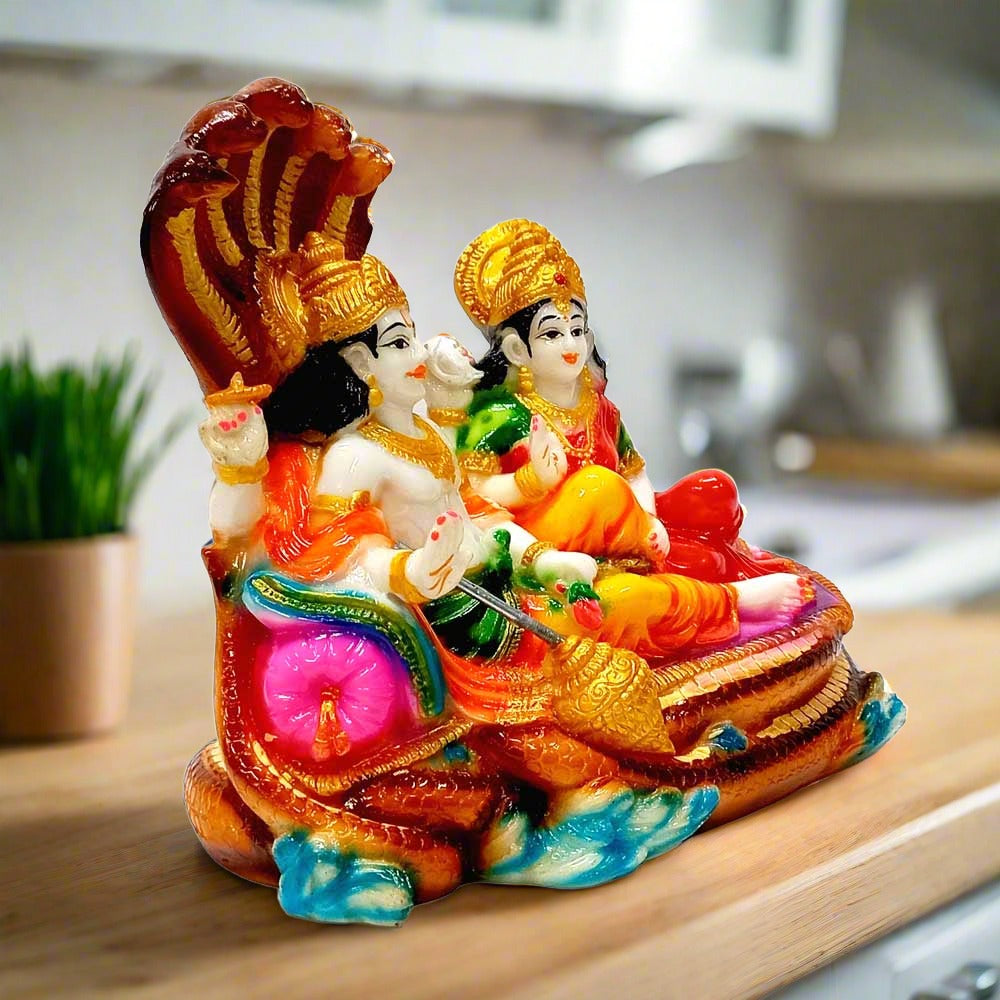 Handcrafted Vishnu Lakshmi idol made of marble dust with fine detailing.