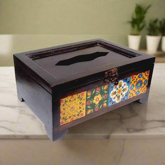 A handcrafted tissue box made from wood and decorative blue pottery tiles.