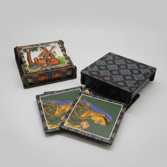 A set of 6 handcrafted wooden coasters with designer prints stored in a matching wooden stand.