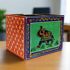  A handcrafted wooden office desk organizer with a stunning hand-painted elephant design.