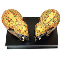 A handcrafted wooden elephant memento, perfect as a souvenir or keepsake.
