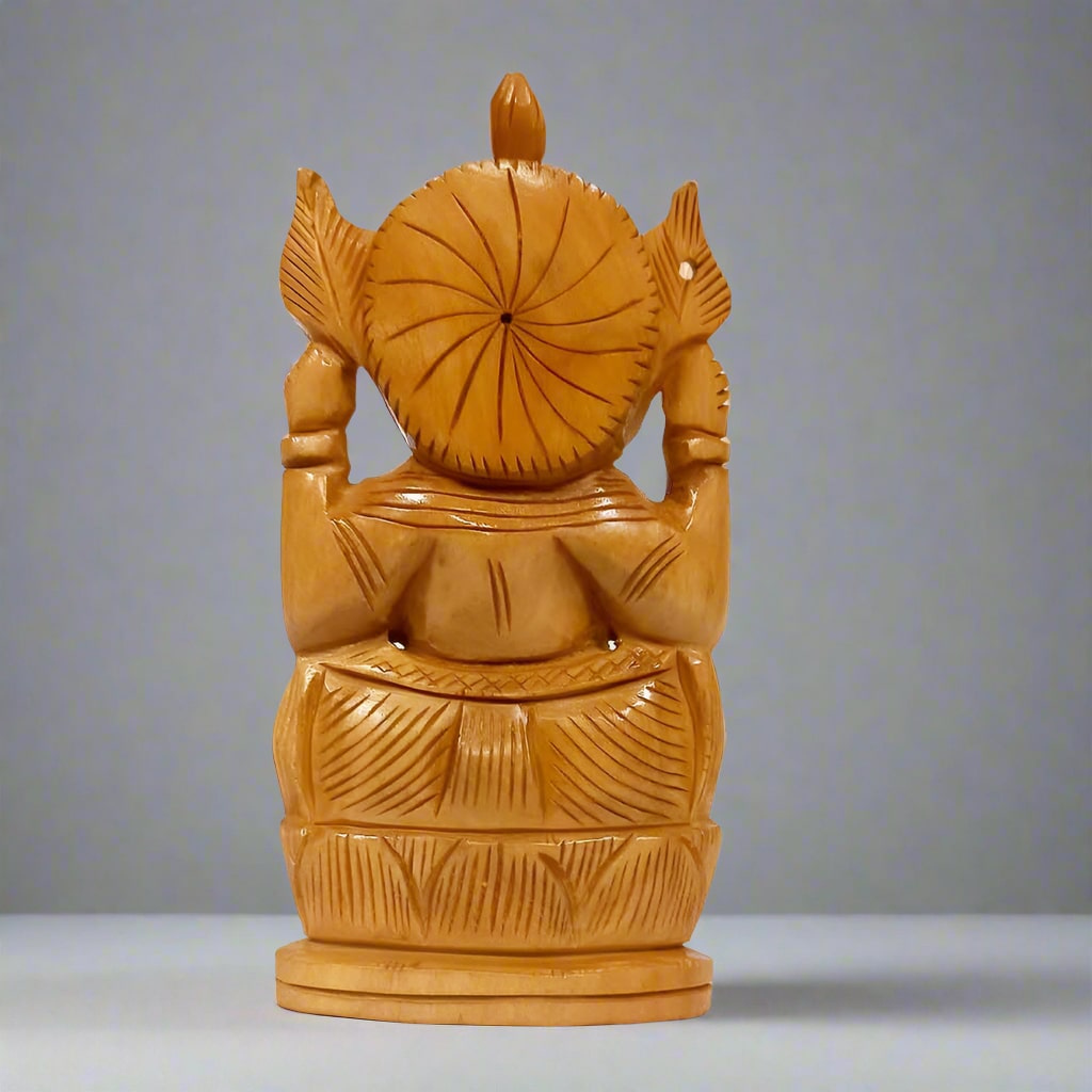 Traditional wooden Ganpati statue with fine craftsmanship, perfect for home decor and spiritual use
