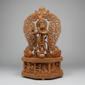 Handcrafted wooden Krishna idol with intricate jali arch and peacocks — Jaipur wood carving