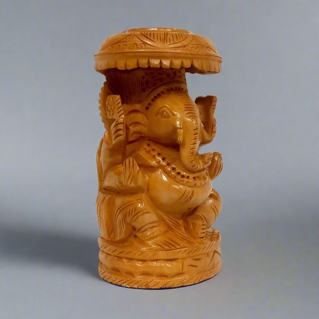 Elegant wooden Ganesha statue featuring unique umbrella design and detailed carvings, symbolizing good luck and positivity